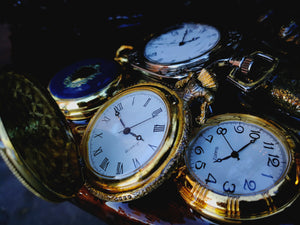 Steampunk manikin light close up view of pocket watch detail on bench