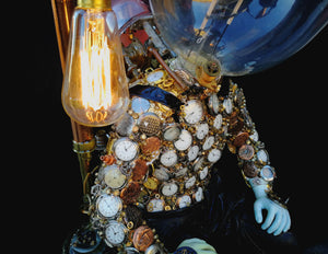 Steampunk manikin boy with pocket watch detail view of light