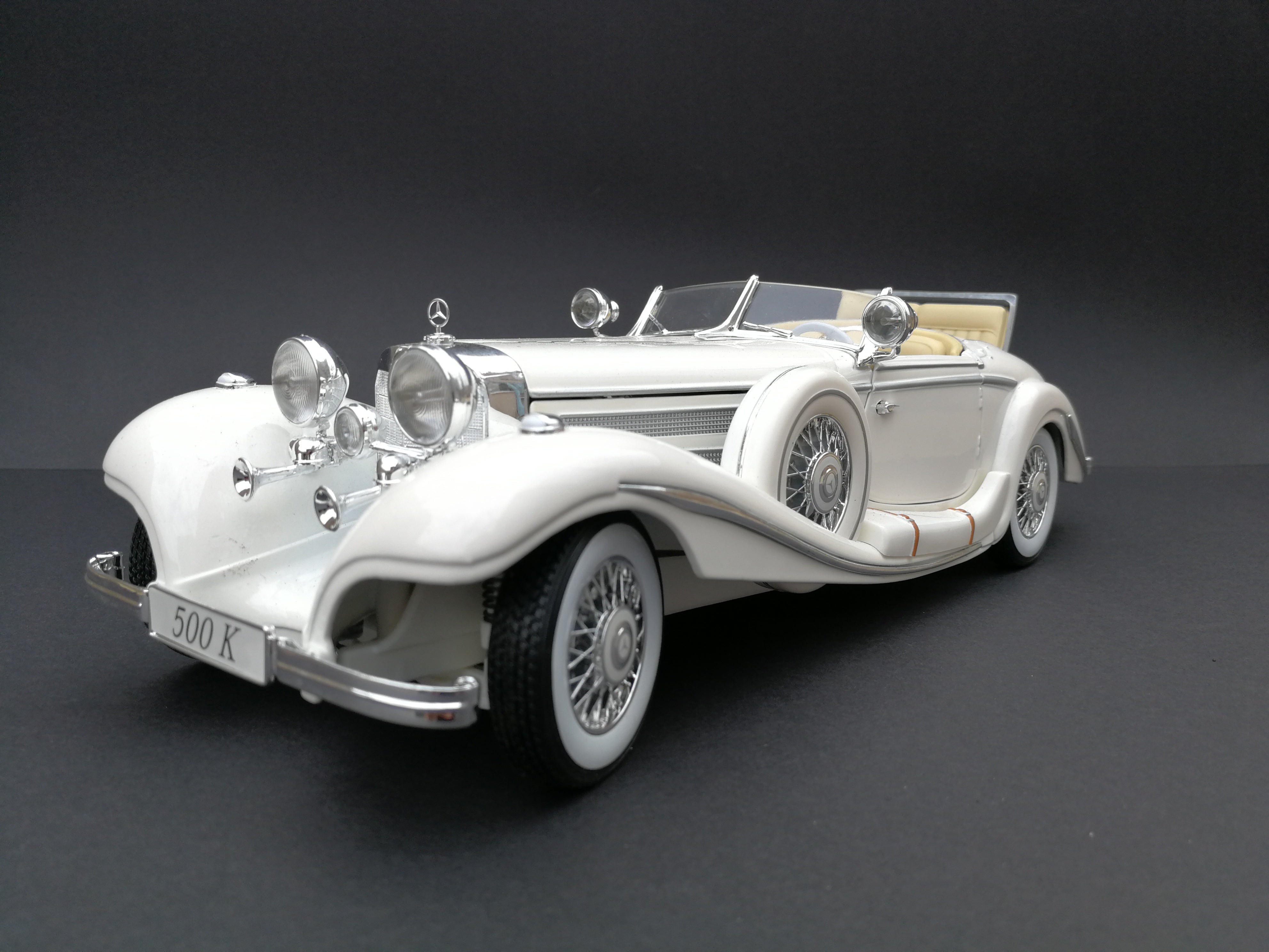 1936 Mercedez Benz 500K special roadster Diercast car. Scale: 1/18. White. 45 degree view.