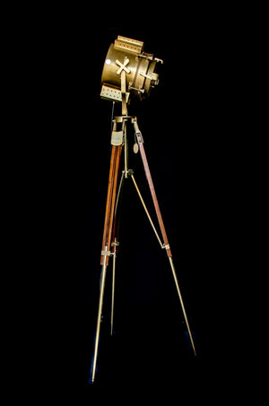 Dumpy level tripod lamp with spot light on top side view