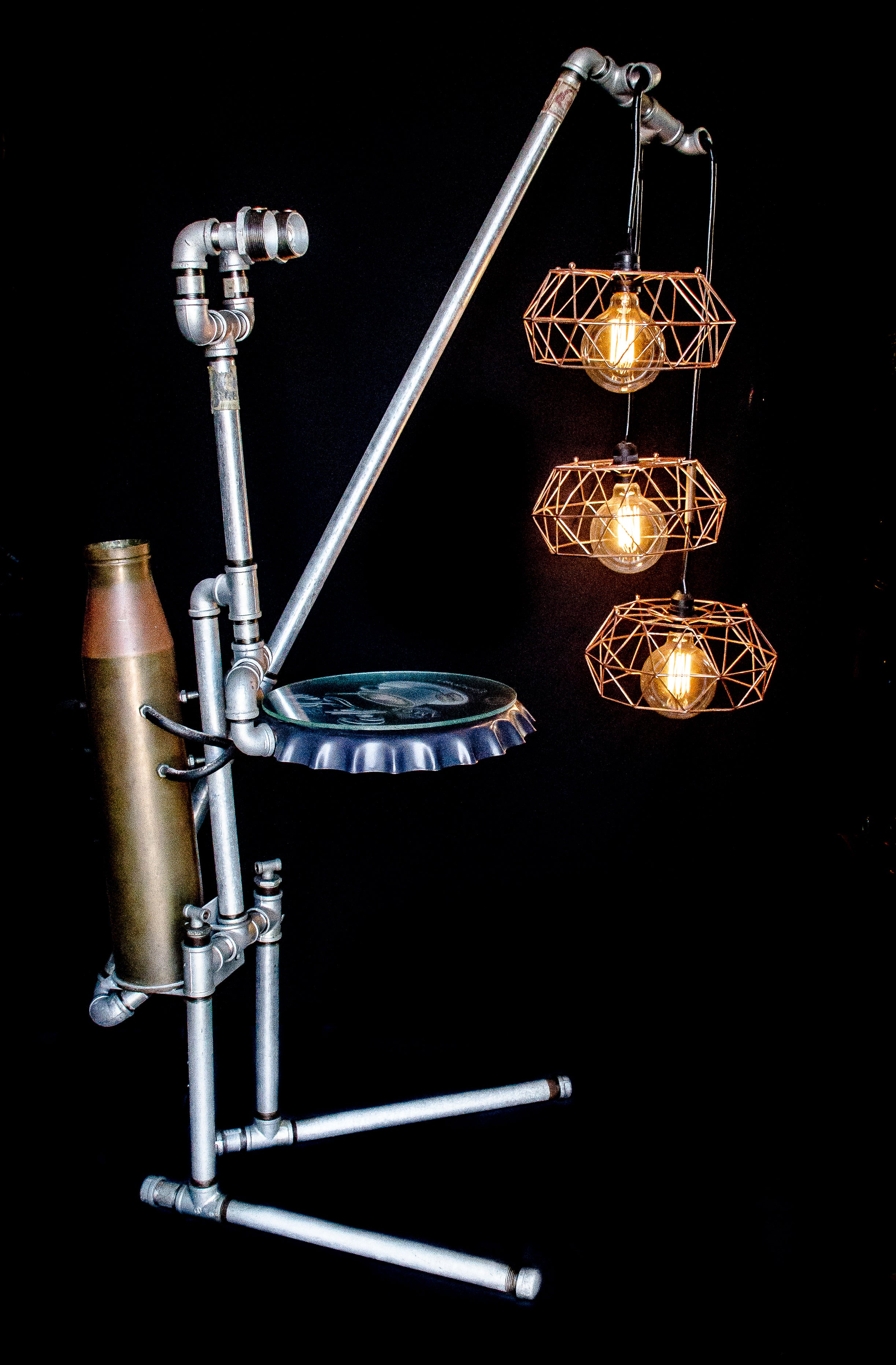 Floor lamp made from galvanized pipes with 3 hanging bulbs, side view